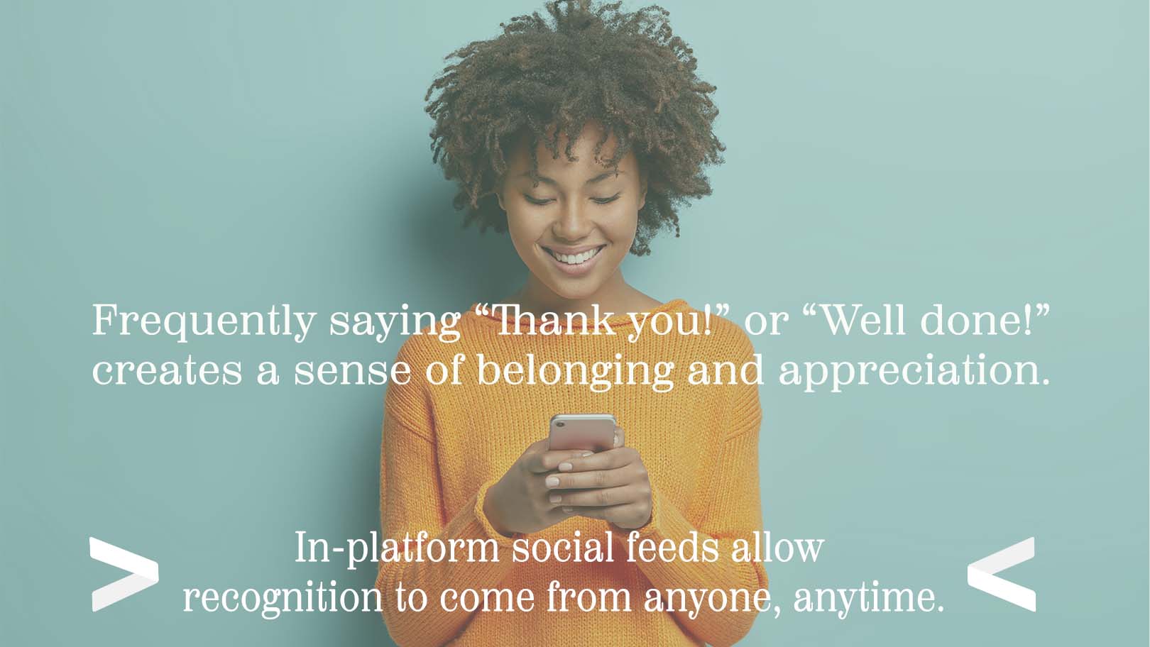 A woman smiles after being recognized for her hard work.